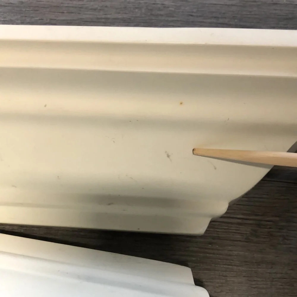 Four all white shelves with some light little scratches